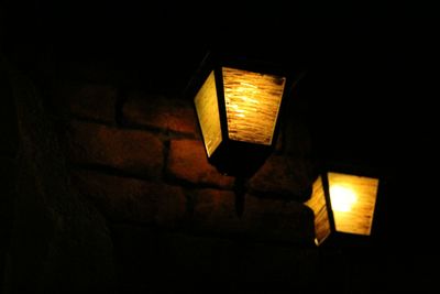 Low angle view of lamp post at night