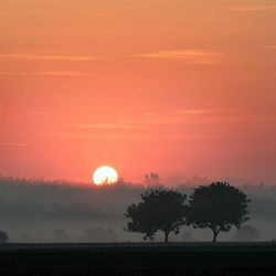 Scenic view of landscape at sunset