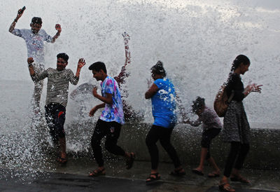 Group of people enjoying in water