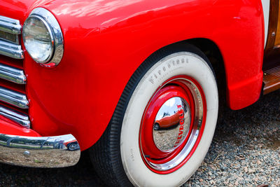 Close-up of red vintage car on street