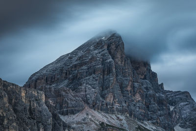 Low angle view of rock formation against sky