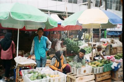 People at market stall