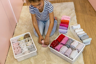 High angle view of girl playing with toy blocks on table