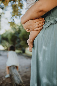 Rear view of woman with hands