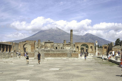 People at town square against sky in pompeji 