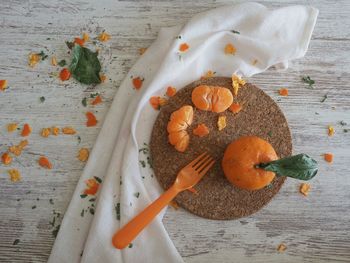 High angle view of orange fruits on table
