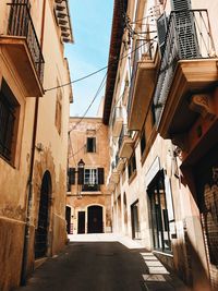 Narrow alley amidst buildings in city