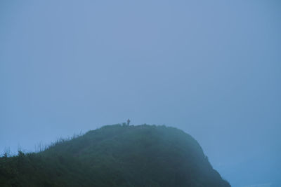 Low angle view of mountain against clear sky