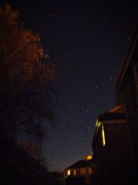 Low angle view of illuminated sky at night