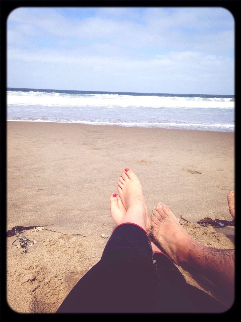 beach, sand, sea, horizon over water, shore, transfer print, sky, water, low section, auto post production filter, lifestyles, leisure activity, person, relaxation, barefoot, tranquility, tranquil scene, vacations