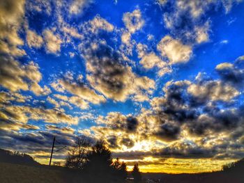 Low angle view of dramatic sky during sunset