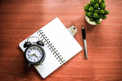 High angle view of clock on table