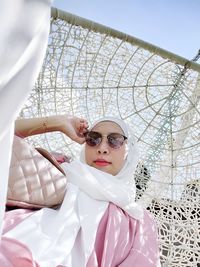 Portrait of young woman in sunglasses