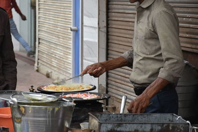 Man preparing food on cutting board