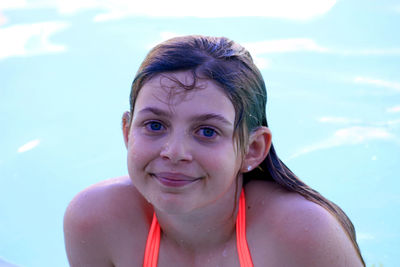 Portrait of wet girl in swimming pool
