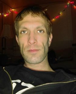 Portrait of young man at home