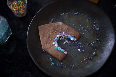 Preparing homemade gingerbread houses for christmas 2021