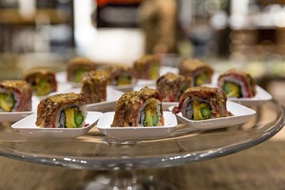 Sushi in plates on table