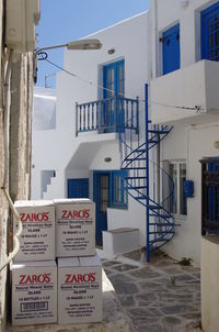 Information sign on built structure against sky