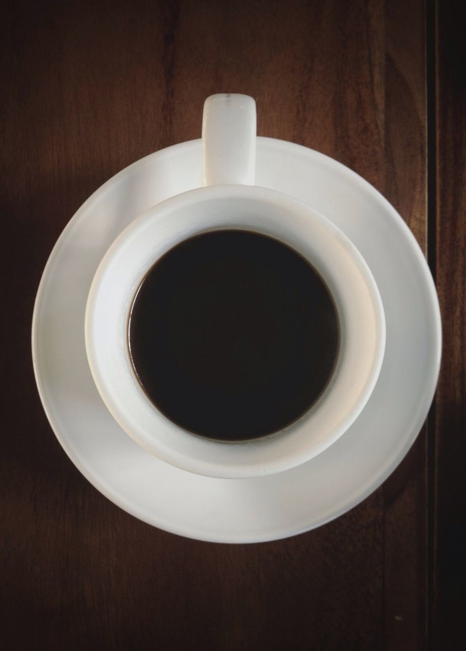 coffee cup, indoors, drink, food and drink, refreshment, saucer, coffee - drink, coffee, table, cup, freshness, directly above, still life, high angle view, close-up, tea cup, black coffee, tea, beverage, white color