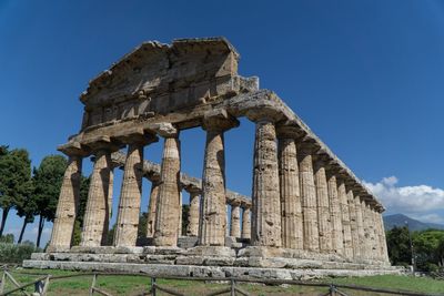 Low angle view of temple against clear blue sky