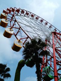 Low angle view of ferries wheel against sky