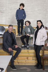 Portrait of happy family at recycling center