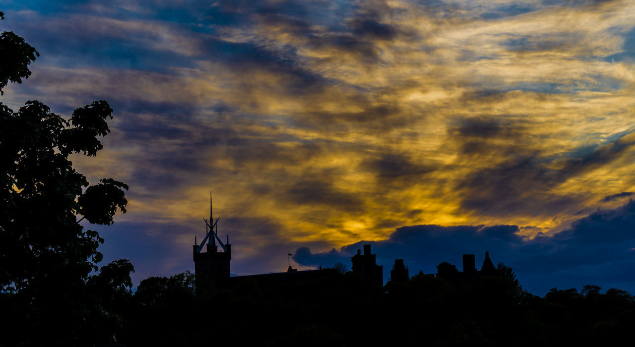 SILHOUETTE OF BUILDINGS AT SUNSET