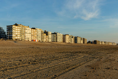 Beach against sky in city