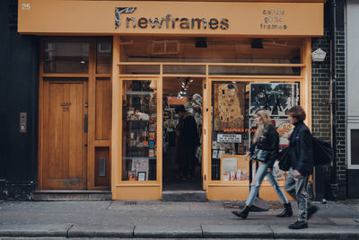 People walking in front of store