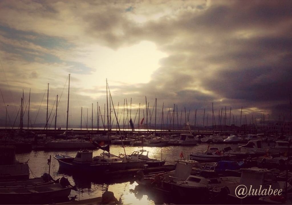 nautical vessel, transportation, moored, water, mode of transport, boat, sky, cloud - sky, harbor, cloudy, sea, mast, weather, nature, waterfront, tranquility, cloud, sailboat, reflection, beauty in nature