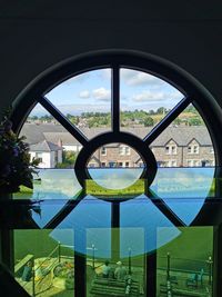 Built structure seen through glass window