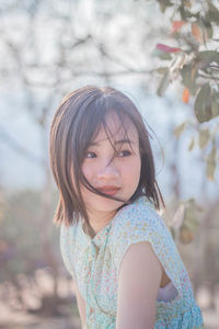 Portrait of a girl standing outdoors