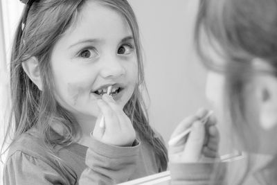 Portrait of cute girl eating food