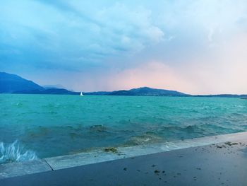 Scenic view of sea against cloudy sky