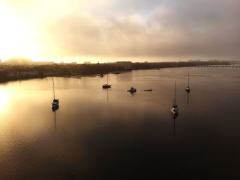 Scenic view of lake at sunset