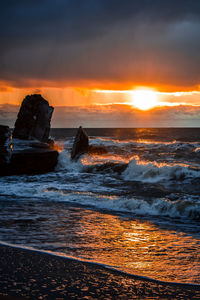 Scenic view of sea against sky during sunset