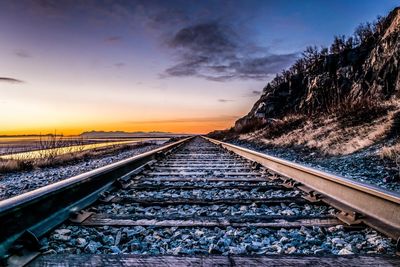 Surface level of railroad tracks against sky