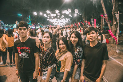 Group of people in traditional clothing at night