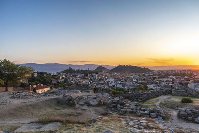 Townscape against sky during sunset