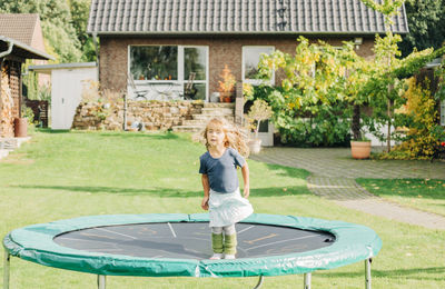 Full length of boy playing in park