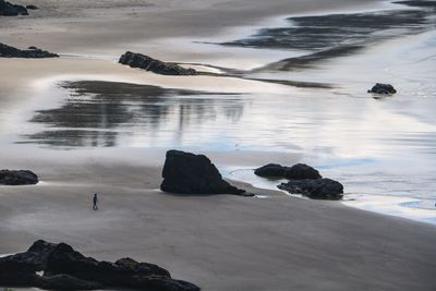 Scenic view of sea and rocks against sky