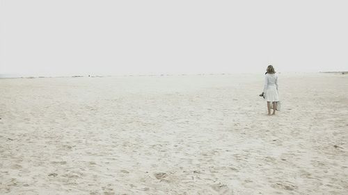 Woman standing on beach