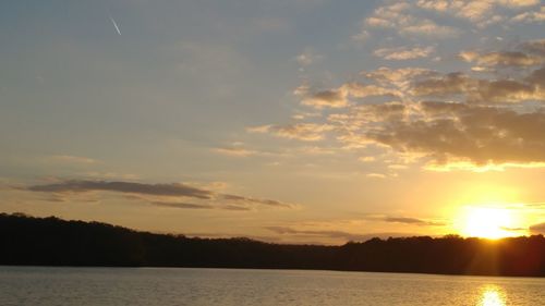Scenic view of silhouette trees against sky during sunset