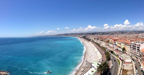 View of cityscape against blue sky