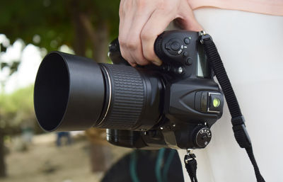 Close-up of hand holding camera