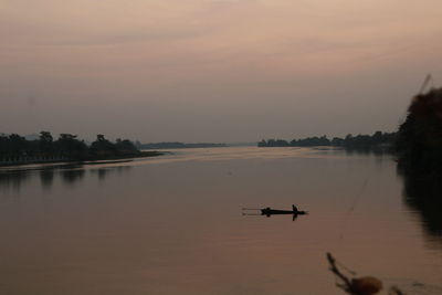 Scenic view of river against sky during sunset