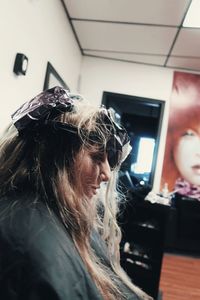 Portrait of woman looking away at home