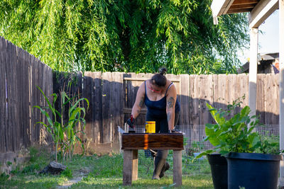 Side view of man working at park