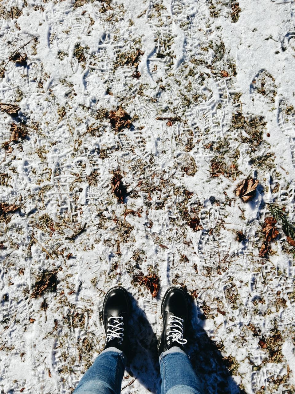 LOW SECTION OF PERSON STANDING ON GROUND